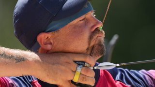 Brady Ellison competes in Tokyo