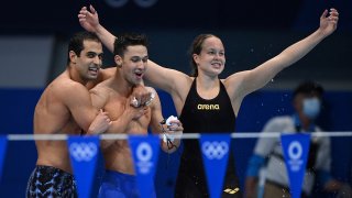 Israel's Anastasya Gorbenko, Itay Goldfaden and Gal Cohen Groumi cheer after qualifying in a heat for the mixed 4x100m medley relay.