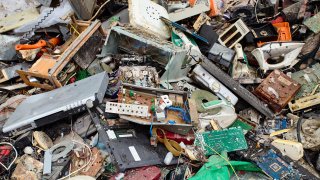 Electronic waste is sorted and prepared for further processing reusing.