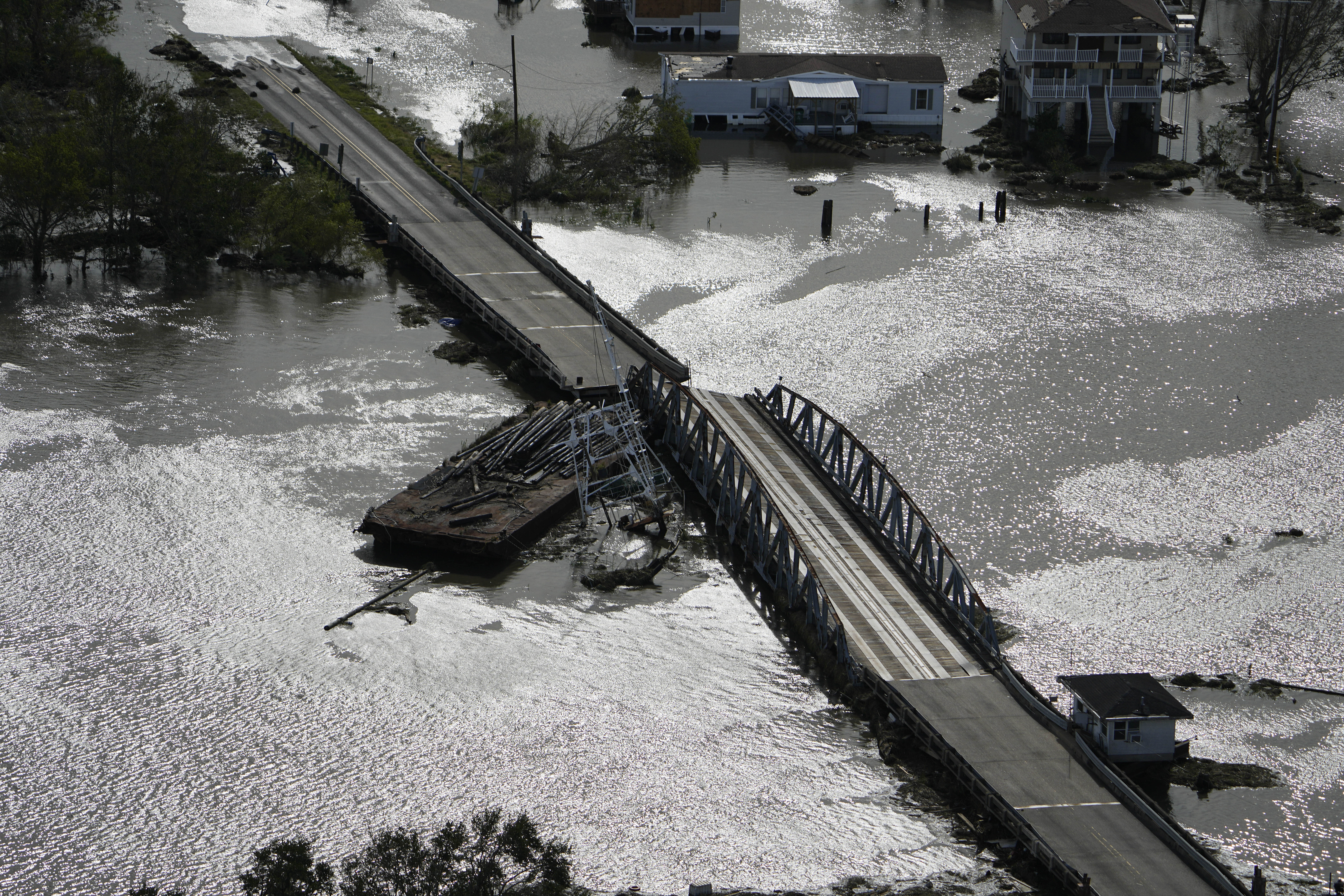 A barge damages a bridge that divides Lafitte, La., and Jean Lafitte, in the aftermath of Hurricane Ida, Monday, Aug. 30, 2021, in Lafitte, La.