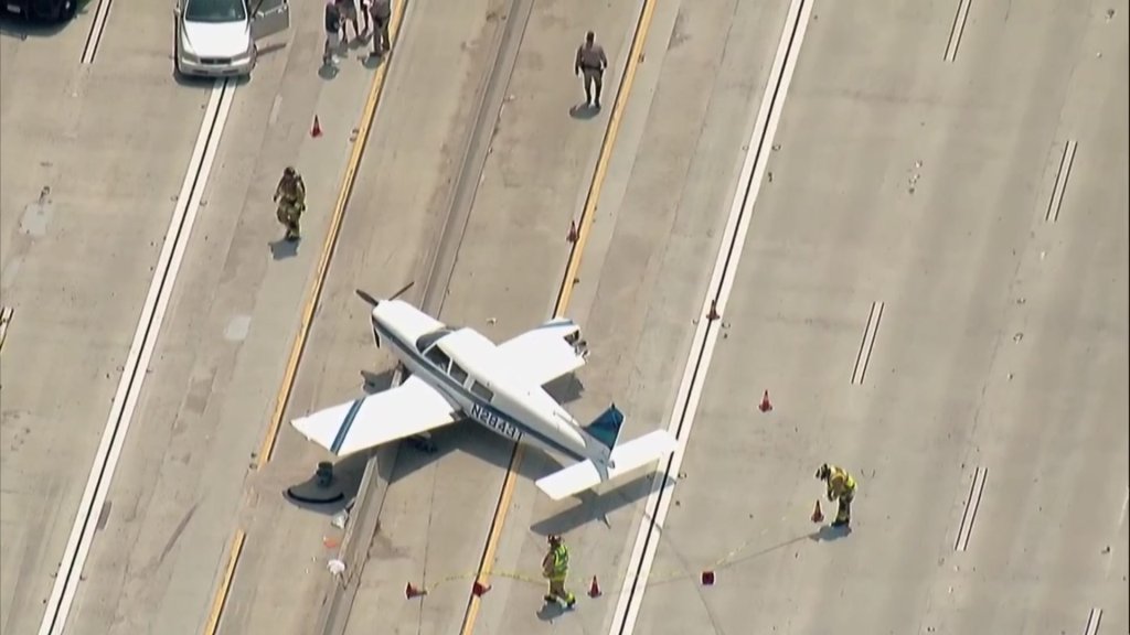 Aerial image shows first responders at the scene of the plane landing.