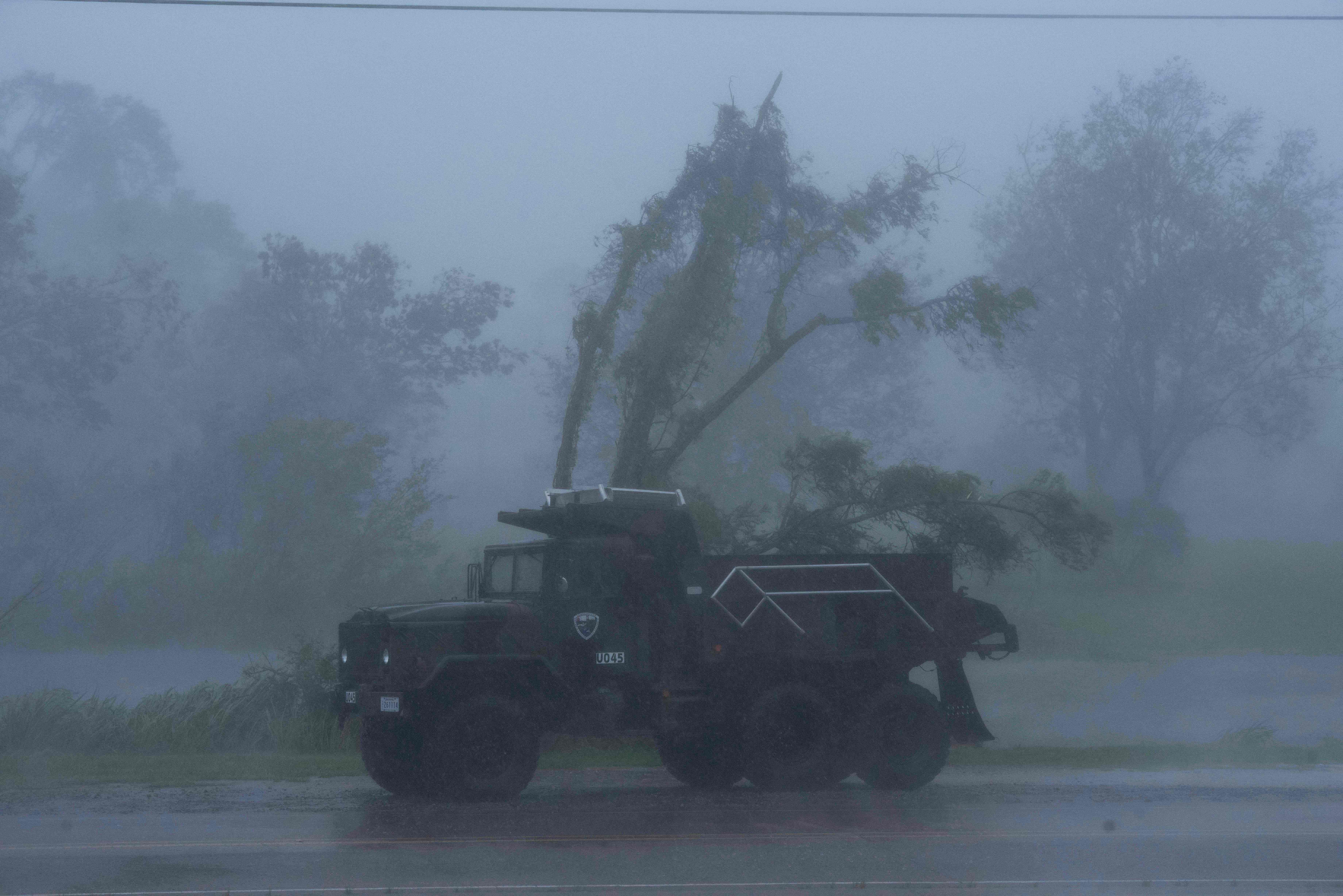 A truck is seen in heavy winds and rain from hurricane Ida in Bourg, Louisiana, on Aug. 29, 2021.