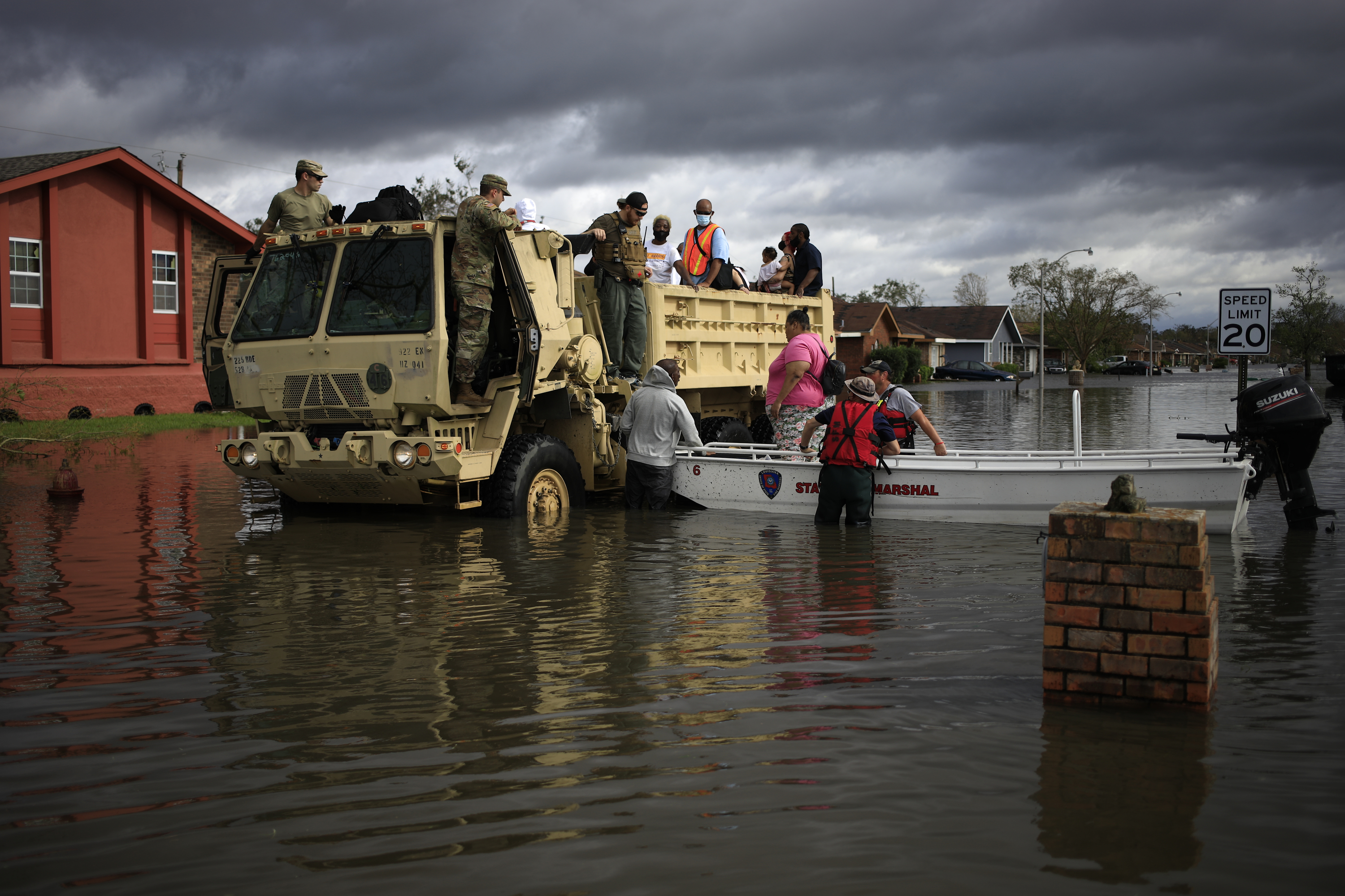 First responders drive a high water vehicle through flooded streets while rescuing residents from floodwater left behind by Hurricane Ida in LaPlace, Louisiana on Monday, Aug. 30, 2021.