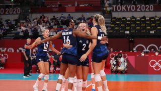 Foluke Akinradewo #16, Jordyn Poulter #2 and Andrea Drews #11 of Team United States celebrate while competing against Team Serbia during the Women's Semifinals on day fourteen of the Tokyo 2020 Olympic Games at Ariake Arena on August 06, 2021 in Tokyo, Japan.