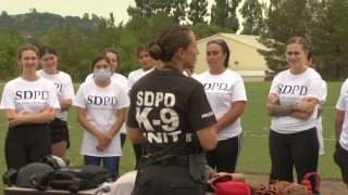 An SDPD K-9 Unit officer speaks to attendees.