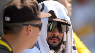 SAN DIEGO, CA – AUGUST 11: Fernando Tatis Jr. #23 of the San Diego Padres, right, sits with Blake Snell #4 during the seventh inning of a baseball game against the Miami Marlins at Petco Park on August 11, 2021 in San Diego, California. (Photo by Denis Poroy/Getty Images)