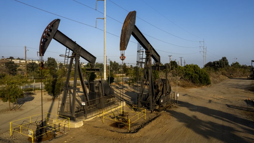 Oil derrick pumps operate at the Inglewood Oil Field in Culver City, California, on Sunday, July 11, 2021.