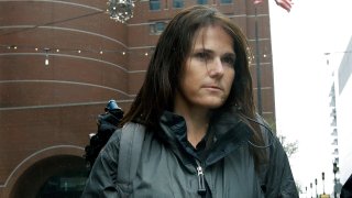 Former University of Southern California soccer coach Laura Janke departs federal court, Tuesday, May 14, 2019, in Boston, where she pleaded guilty to charges in a nationwide college admissions bribery scandal.