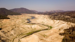 A nearly empty section of Lake Oroville is seen from above in Oroville, California.