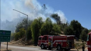 A brush fire burned less than a quarter-acre Wednesday near Home Avenue in San Diego.