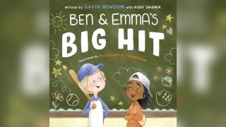 This cover image released by Penguin Young Readers shows “Ben and Emma’s Big Hit” written by by California Governor Gavin Newsom with Ruby Shamir and illustrated by Alexandra Thompson.