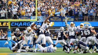 Kicker Greg Zuerlein #2 of the Dallas Cowboys kicks the game winning FG to defeat the Los Angeles Chargers 20-17 at SoFi Stadium on Sept. 19, 2021 in Inglewood, California.