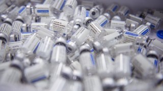 13 June 2021, Mecklenburg-Western Pomerania, Wismar: Empty ampoules of Johnson & Johnson’s Janssen vaccine lie in a waste container that has been administered in the MV Werften company canteen, which has been converted into a vaccination centre for the day. Every citizen could register for an appointment on an internet portal beforehand. This made it possible for the shipbuilding company, together with the ear, nose and throat specialist Michael Salz, to offer many vaccination appointments with the vaccine from Johnson & Johnson on one day, in order to vaccinate those interested against the coronavirus. Photo: Gregor Fischer/dpa (Photo by Gregor Fischer/picture alliance via Getty Images)