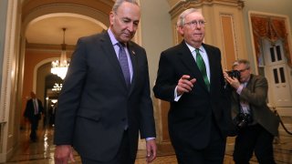 Senate Minority Leader Charles Schumer (D-NY) (L) and Senate Majority Leader Mitch McConnell (R-KY) walk side-by-side to the Senate Chamber at the U.S. Capitol February 7, 2018 in Washington, DC.