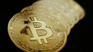 Representations of the Bitcoin cryptocurrency are seen in this photo illustration.