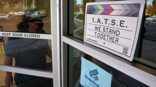 A man enters the union offices of The International Alliance of Theatrical Stage Employees (IATSE) Local 80, Monday, Oct. 4, 2021, in Burbank, Calif.