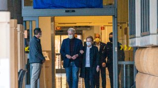 Former President Bill Clinton and former U.S. Secretary of State Hillary Clinton leave the University of California Irvine Medical Center in Orange, Calif.
