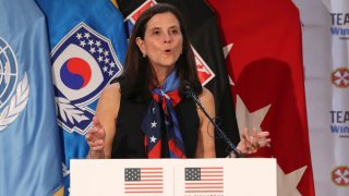 FILE - In this Aug. 1, 2017, file photo, then-U.S. Olympic Committee chief marketing officer Lisa Baird speaks about the Team USA WinterFest for the upcoming 2018 Pyeongchang Winter Olympic Games, at Yongsan Garrison, a U.S. military base in Seoul, South Korea. National Women's Soccer League Commissioner Lisa Baird is out after some 19 months on the job amid allegations that a former coach engaged in sexual harassment and misconduct toward players, a person with knowledge of the situation told The Associated Press. The person spoke to the AP on the condition of anonymity because the move Friday, Oct. 1, 2021 had not been made public.