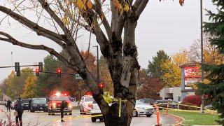 Police close off a street outside a shopping mall after a shooting in Boise, Idaho on Monday, Oct. 25, 2021. Police said there are reports of multiple injuries and one person is in custody.