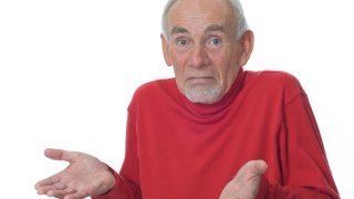 older person confused by merriam-webster dictionary