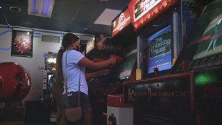 Customers play games at Arcade Odyssey in Miami, Florida. The southernmost arcade in the United States has seen hard times but its owner Rick Medina says he was stubborn and wanted to keep it going. The culture of arcades paved the way for modern esports culture and tournaments.