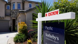 A single family home is shown for sale and in escrow in San Marcos, California.