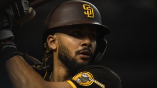 PHOENIX, ARIZONA – AUGUST 31: Fernando Tatis Jr #23 of the San Diego Padres gets ready to step into the batters box against the Arizona Diamondbacks at Chase Field on August 31, 2021 in Phoenix, Arizona. (Photo by Norm Hall/Getty Images)