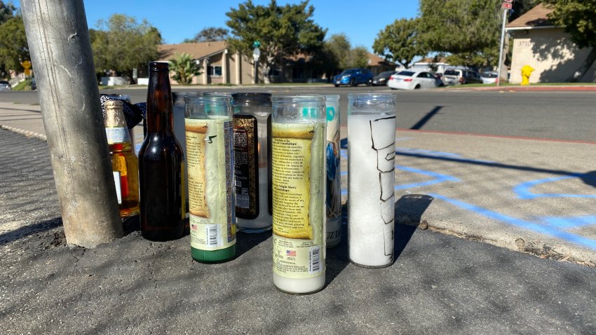 Candles are set up in San Diego's Skyline neighborhood on Friday, Nov. 26, 2021 following the death of a 12-year-old boy.