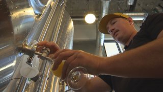 dude pours a beer