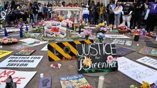 Protesters gather around a memorial for Breonna Taylor at Jefferson Square Park in Louisville, Ky., Saturday, March 13, 2021. Today marked the one year anniversary of her death.