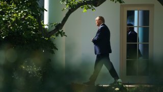 In this photo, U.S. President Donald Trump exits the Oval Office and walks toward Marine One on the South Lawn of the White House on September 30, 2020 in Washington, DC.