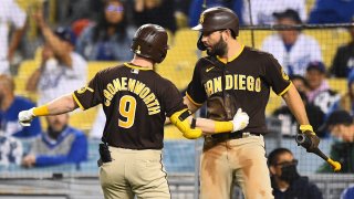 LOS ANGELES, CA – SEPTEMBER 28: San Diego Padres second baseman Jake Cronenworth (9) celebrates his solo home run with San Diego Padres first baseman Eric Hosmer (30) during the MLB game between the San Diego Padres and the Los Angeles Dodgers on September 28, 2021 at Dodger Stadium in Los Angeles, CA. (Photo by Brian Rothmuller/Icon Sportswire via Getty Images)