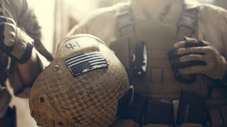 American flag on helmet of US Marine soldier.