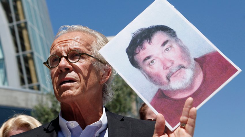 FILE – Attorney Jeff Anderson holds up a photo of former priest Stephen Kiesle at a news conference in Oakland, Calif., Wednesday, Aug. 18, 2010. The family of the late Jim Bartko, who said he was molested as a child by Kiesle, has filed a lawsuit against the Roman Catholic church under a new California law that allows family members of sex abuse victims to bring lawsuits after their deaths. The family of Bartko filed the suit in January 2022 in Alameda County Superior Court against the Diocese of Oakland. (AP Photo/Jeff Chiu, File)