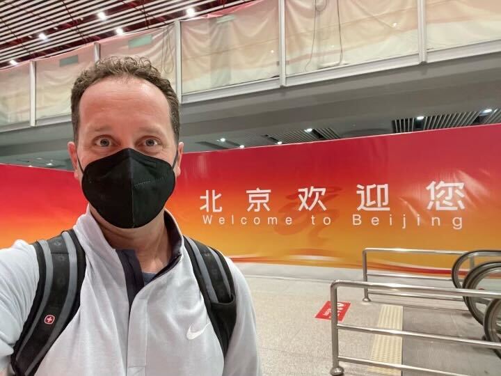 Steven Luke takes a selfie at the Beijing Airport as he arrives for the 2022 Winter Olympics, Jan. 29, 2022.