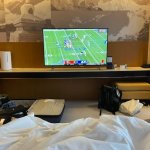A TV in a hotel room in Beijing displays a football game between the San Francisco 49ers and the LA Rams, Jan. 30, 2022.