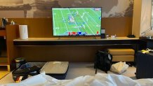 A TV in a hotel room in Beijing displays a football game between the San Francisco 49ers and the LA Rams, Jan. 30, 2022.