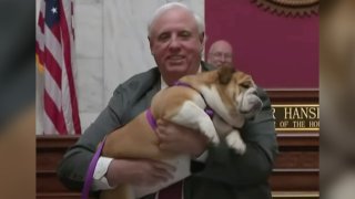 West Virginia Gov. Jim Justice holds his dog during his state of the state address, Jan. 27, 2022.