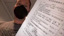 NBC 7 anchor Steven Luke holds papers ready to head to the Winter Olympics in Beijing, Jan. 27, 2022.