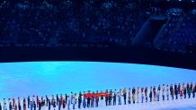 The National Flag of the People's Republic of China arrives during the opening ceremony of the 2022 Winter Olympics, Friday, Feb. 4, 2022, in Beijing.