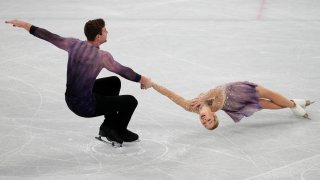 Alexa Knierim and Brandon Frazier, of the United States, compete in the pairs team free skate program during the figure skating competition at the 2022 Winter Olympics, Monday, Feb. 7, 2022, in Beijing.