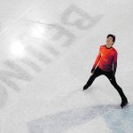 Nathan Chen smiles after completing his routine