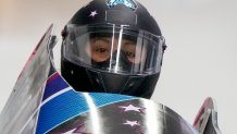 Elana Meyers Taylor, of United States, drives during the Women's Monobob heat 1 at the 2022 Winter Olympics, Feb. 13, 2022, in the Yanqing district of Beijing, China.