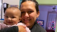 In this Dec. 2020, photo provided by Mary Risling, missing woman Emmilee Risling is seen holding her infant daughter at a home in California
