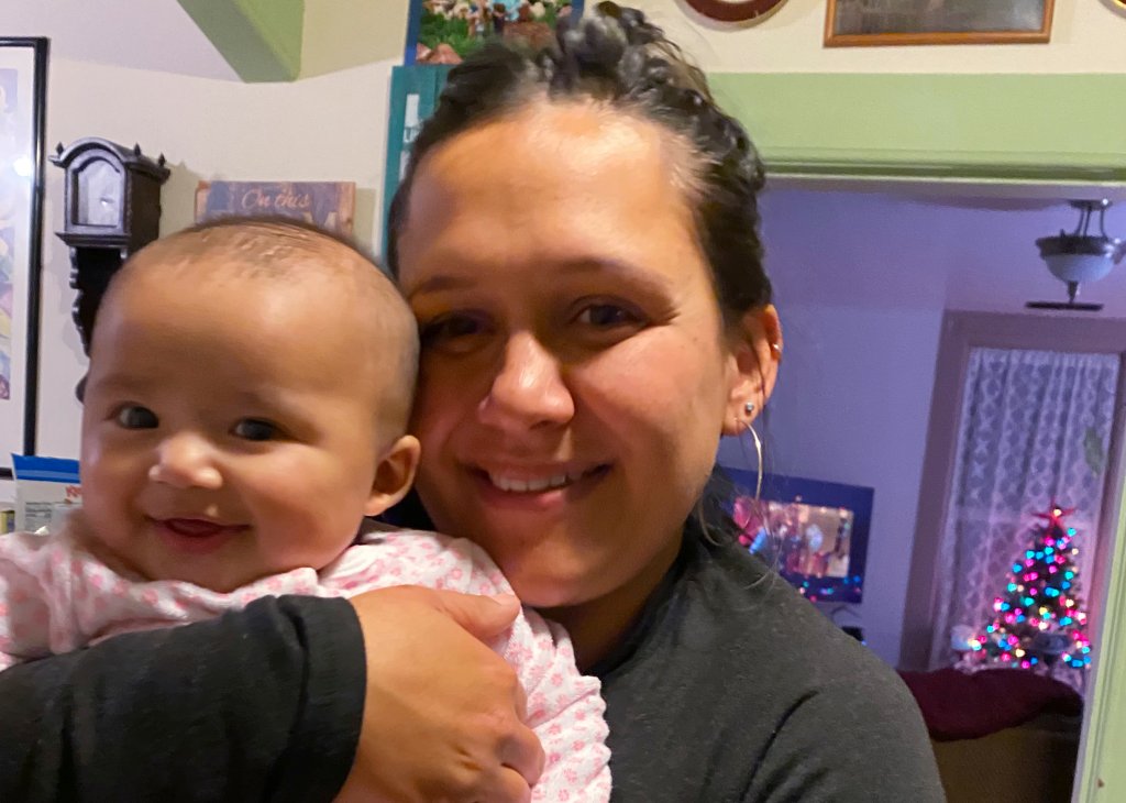 In this Dec. 2020, photo provided by Mary Risling, missing woman Emmilee Risling is seen holding her infant daughter at a home in California