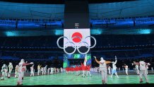 The delegation from Japan walks in the parade of athletes during the opening ceremony of the Beijing 2022 Winter Olympic Games, at the National Stadium, known as the Bird's Nest, in Beijing, Feb. 4, 2022.