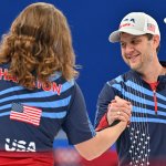 Team USA's John Shuster celebrates with his teammates at the men's round robin curling competition between USA and players of Russia's Olympic Committee, at the National Aquatics Centre in Beijing, Feb. 9, 2022.