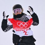 USA's Chloe Kim reacts after her run