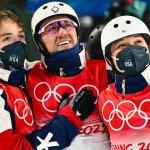 From left: Team USA's Christopher Lillis, Justin Schoenefeld and Ashley Caldwell wins the gold medal on mixed team aerials during the 2022 Winter Olympics in Zhangjiakou, Beijing, Feb. 10, 2022.