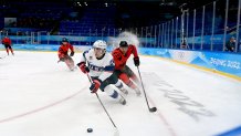 Sean Farrell of USA and Alex Grant of Canada during the Men's Preliminary Round Group A match between USA and Canada on day eight of the 2022 Winter Olympics at National Indoor Stadium in Beijing, China on Feb. 12, 2022.